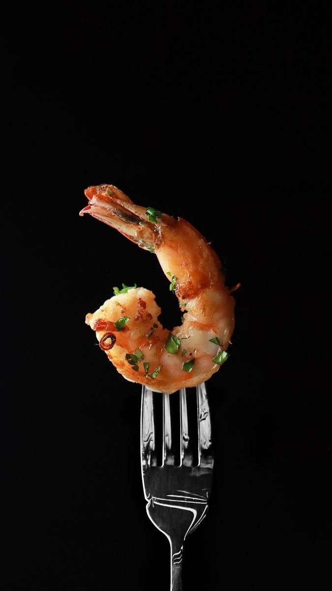 Grilled Gulf shrimp with herbs on a fork